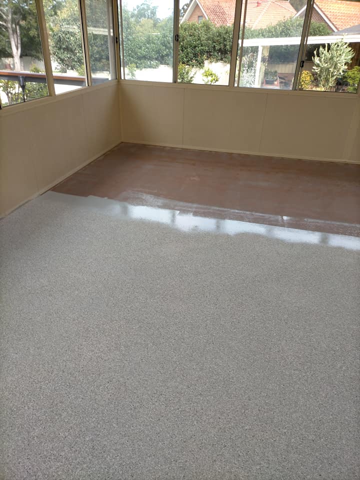 Glossy speckled coating applied over an old tiled sunroom floor